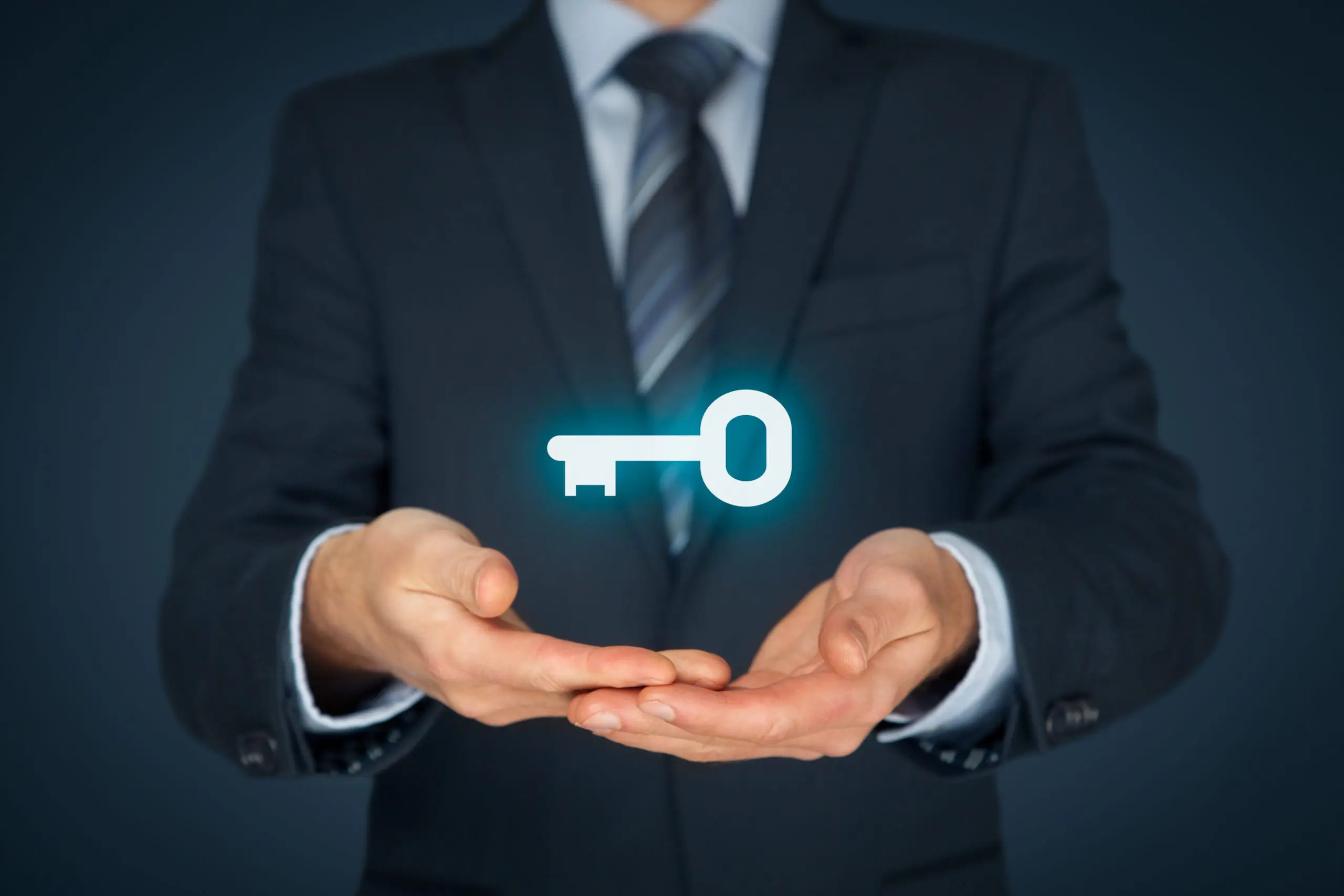 Man with key hovering over his hands - what is a control panel used for - Keltour. 